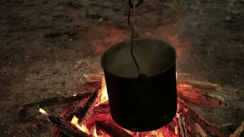 Bonfire cooking. Camp Fire In Wild Camping Stock-Footage 84332943