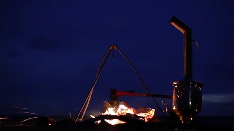 Bonfire. Fireplace. Samovar. Ax. Wind. Sparks Video stock 64460491