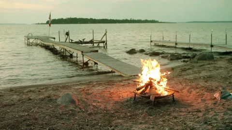 Bonfire Flames in Fire Pit at Beach Sunset in Canada Stock Footage 51180083