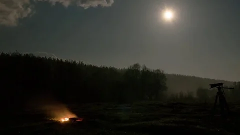 The bonfire goes out and the camera is in the background of the moon, Russia. Stock Footage