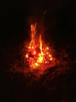 Bonfire in the grass at night Stock Photos