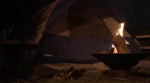 Bonfire infront of tent at night Stock Footage 54171936