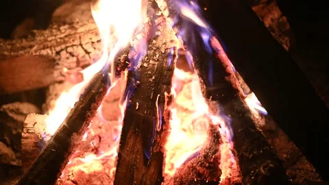 Bonfire at night, logs are burning, sparks are flying. Fire flame close-up. Stockbeeldmateriaal 197574628