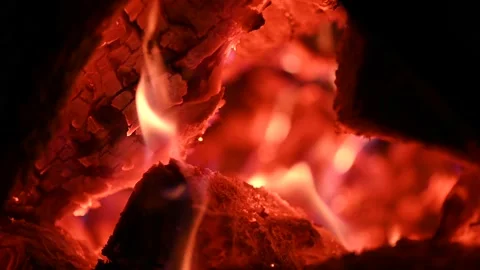 Bonfire at night, logs are burning, sparks are flying. Fire flame close-up. Stock Footage 200805327