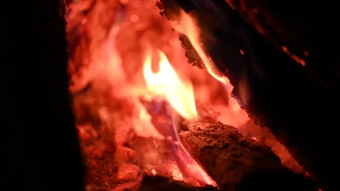 Bonfire at night, logs are burning, sparks are flying. Fire flame close-up. Stock Footage 202057587