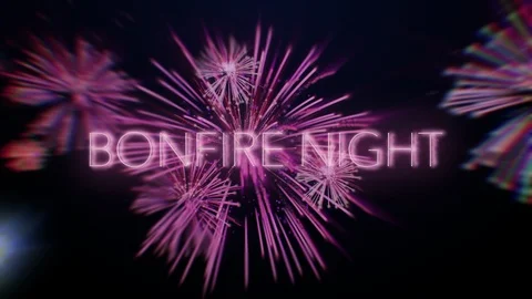 Bonfire Night text with looping colourful fireworks in the night sky Stock Footage 117934947