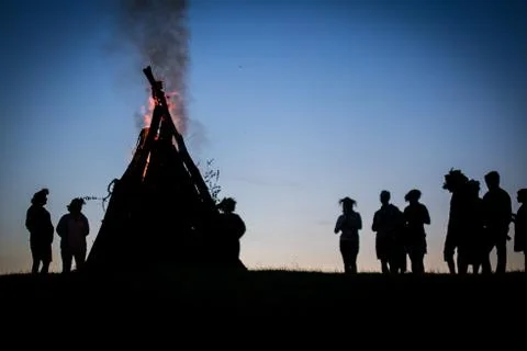 Bonfire with people silhouettes Stock Photos