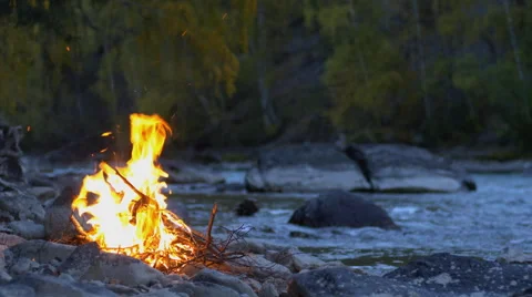 Bonfire by the River at Twilight Seamless Loop Footage Stock Footage 63618379
