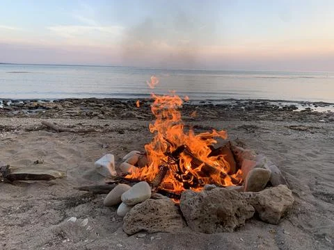 Bonfire by the seaside Stock Photos