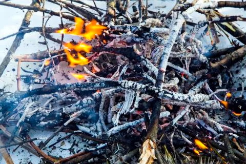 A bonfire on the snow in the winter. Stock Photos