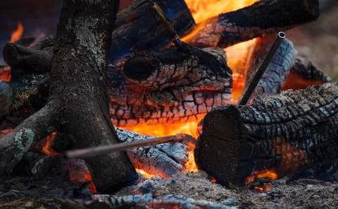 Bonfire with some metall blacksmith's instruments Stock Photos