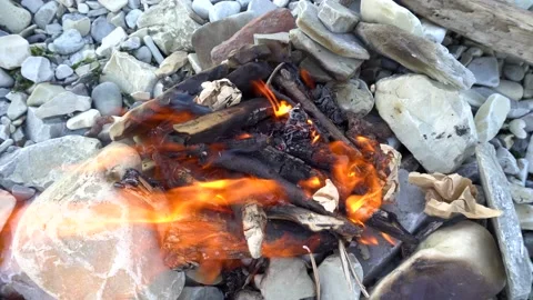 Bonfire on the stone seashore 4K Stock Footage 159021943