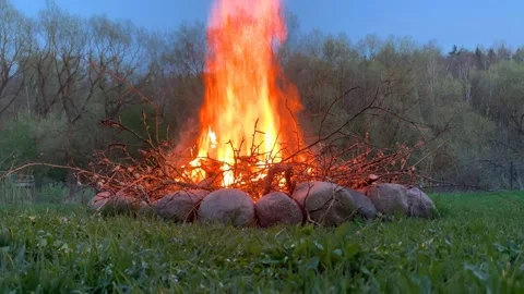 Bonfire surrounded by stones Stock Footage 296442613