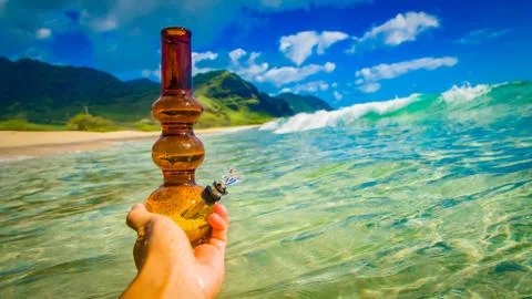Bong in hand in surf Stock Photos