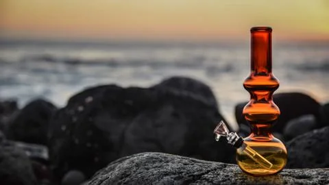 Bong on the ocean rocks Stock Photos