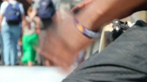 Bongo playing with people walking in the distance Video stock 11146262