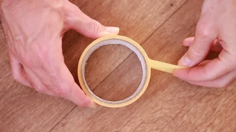 Boobin of adhesive tape on the floor Vídeo Stock 101676980