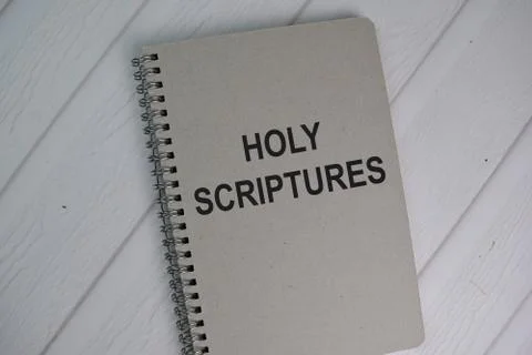 Book about Holy Scriptures isolated on wooden table. Foto stock