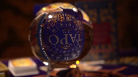 A book about Tarot in Russian is visible through the magic ball Stock Footage 162985996