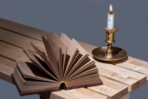 Book And Candle Stock Photos