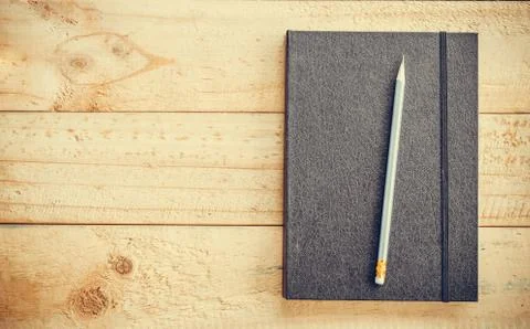 Book and pen Stock Photos