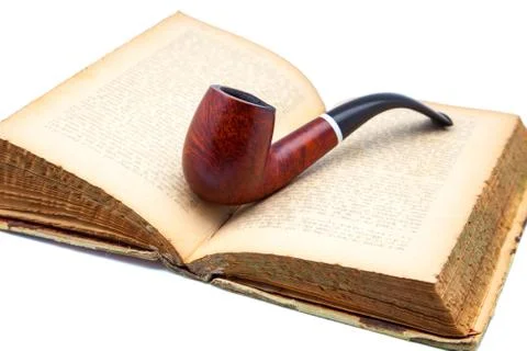 Book and  pipe Stock Photos