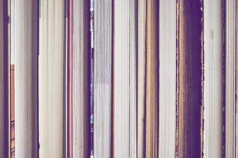Book background made of many text blocks. Stock Photos