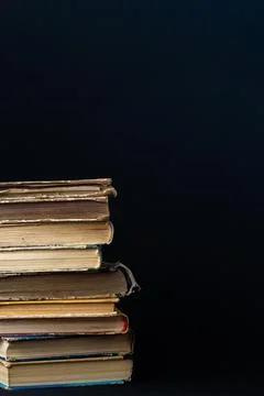 Book background. Stack of books in the library. Old yellow pages of paper boo Stock Photos