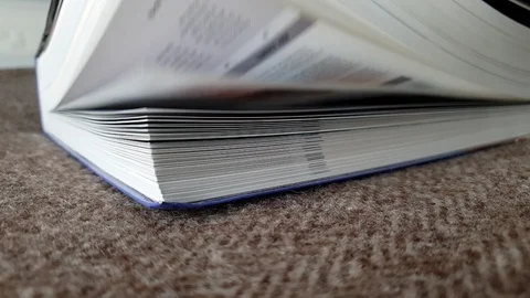 Book on a bed Slowmotion Pages Stock Footage 128701677