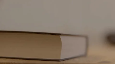 Book Being Closed at Desk - Close Up, Shallow Depth HD 스톡 동영상 54759372