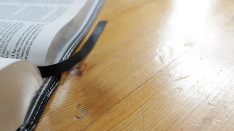 Book / Bible open on table Stock Photos