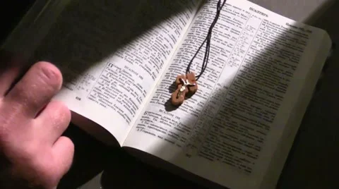 Book of the Bible opens by hand 스톡 동영상 57213067