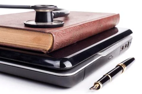 Book on Black Laptop Stock Photos