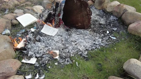 Book burning in a campground Stock Footage 167569142