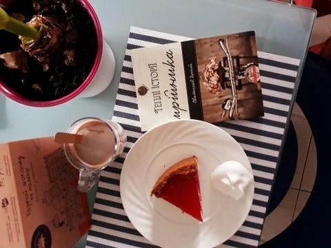 A book with a cake in the table 写真素材