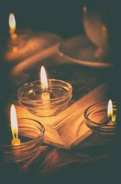 Book by candlelight Stock Photos