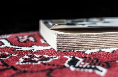 Book on carpet Stock Photos