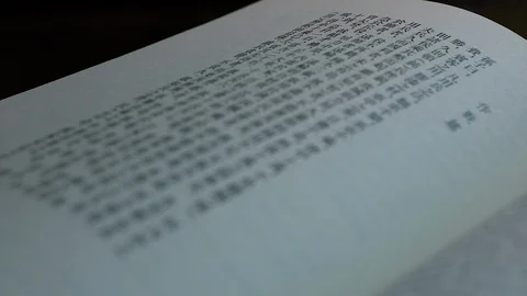 Book in Chinese Closeup Racking Focus Stock Footage 102154820