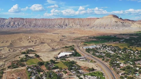 Book Cliffs Mesa Clifton Grand Junction aerial drone afternoon cloudy Grand 動画素材 343735828