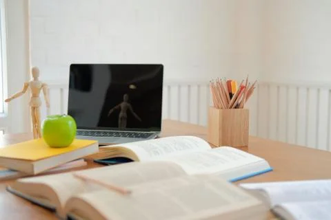 Book computer on desk table for studying. back to school &amp; education concept Stock Photos