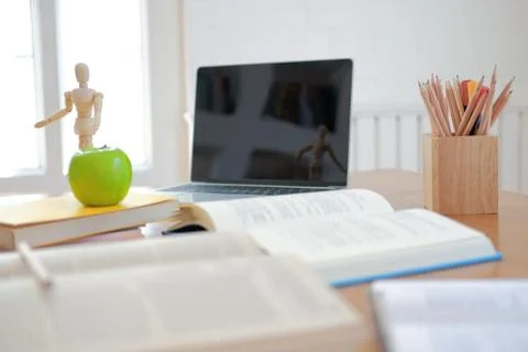 Book computer on desk table for studying. back to school &amp; education concept Stock Photos