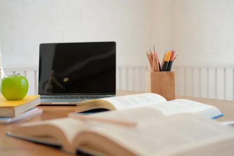 Book computer on desk table for studying. back to school &amp; education concept Stock Photos