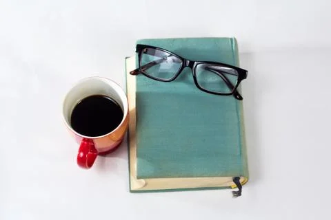 Book with cup Stock Photos