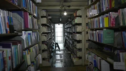 Book depository of the old large city library. shelves with books. Stock Footage 317749561