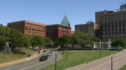 Book Depository with plane flying over skyline of Dallas Video stock 48926551