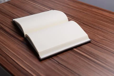 The book is at the desk. Stock Photos