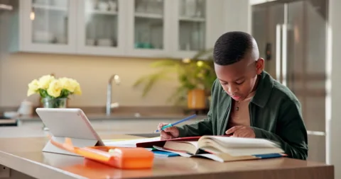 Book, elearning and tablet with black child in kitchen in home for reading Stock Footage 341561584