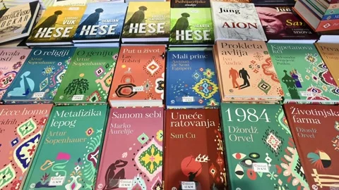 Book exhibition. Selection of books on display in store. Stock Footage 238486722