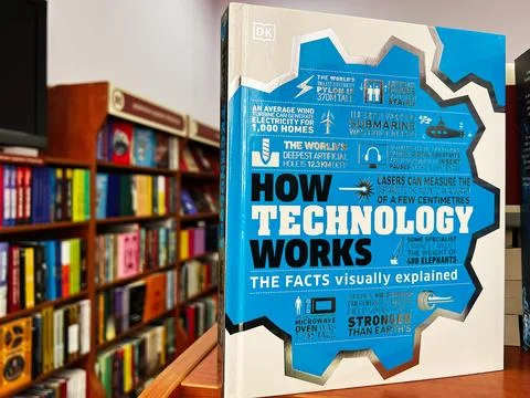 Book explaining technology with facts and visuals displayed in a bookstore .. Stock Photos
