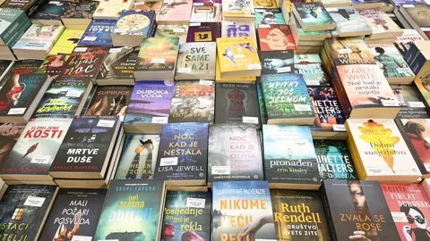 Book Fair. Book exhibition. Selection of books on display in store. Stock Footage 238487898